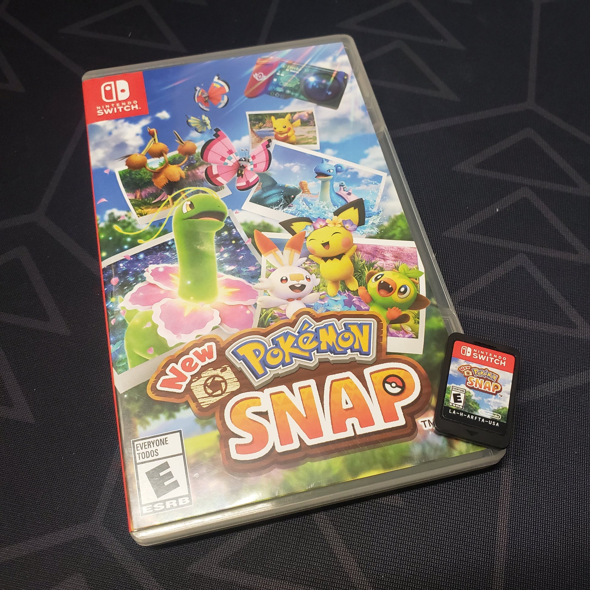 Image shows the case & cartridge for the video game New Pokemon Snap for Nintendo Switch