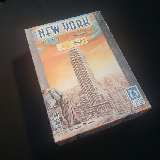 Image shows the front cover of the box of the New York board game