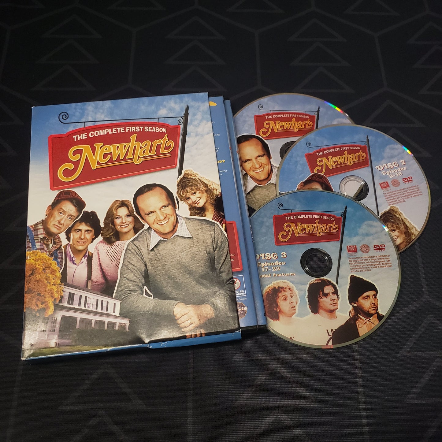 Image shows the cases, outer box & three discs for Newhart: Season 1 on DVD