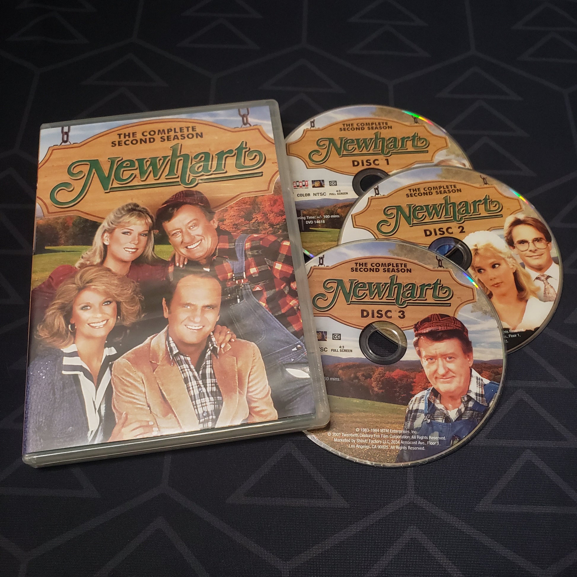 Image shows the case & three discs for Newhart: Season 2 on DVD