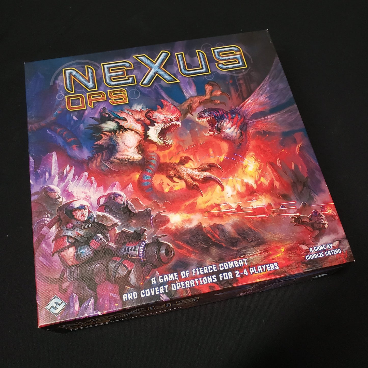 Image shows the front cover of the box of the Nexus Ops board game