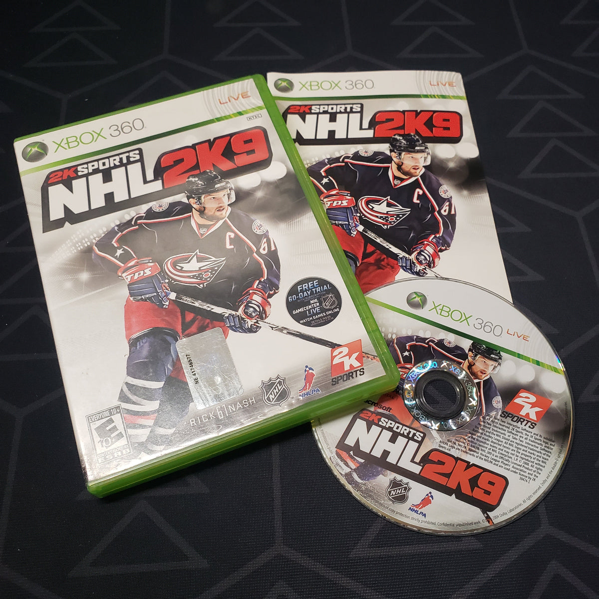 Image shows the case, manual and disc for the video game NHL 2K9 for Xbox 360