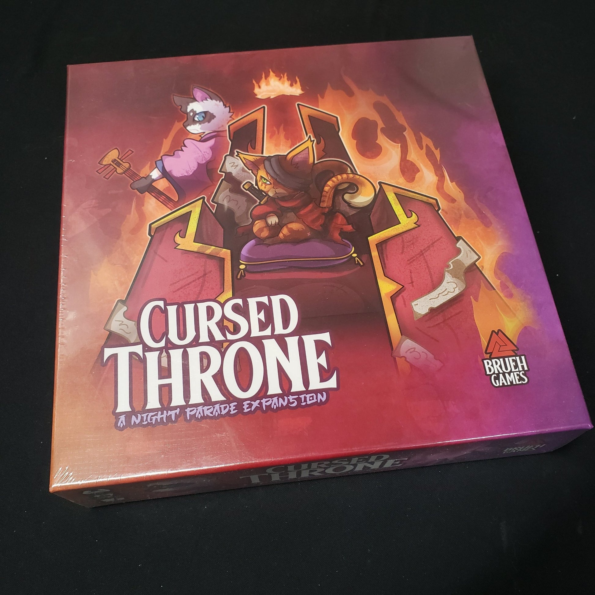 Image shows the front cover of the box of the Cursed Throne expansion for the board game Night Parade of a Hunderd Yokai