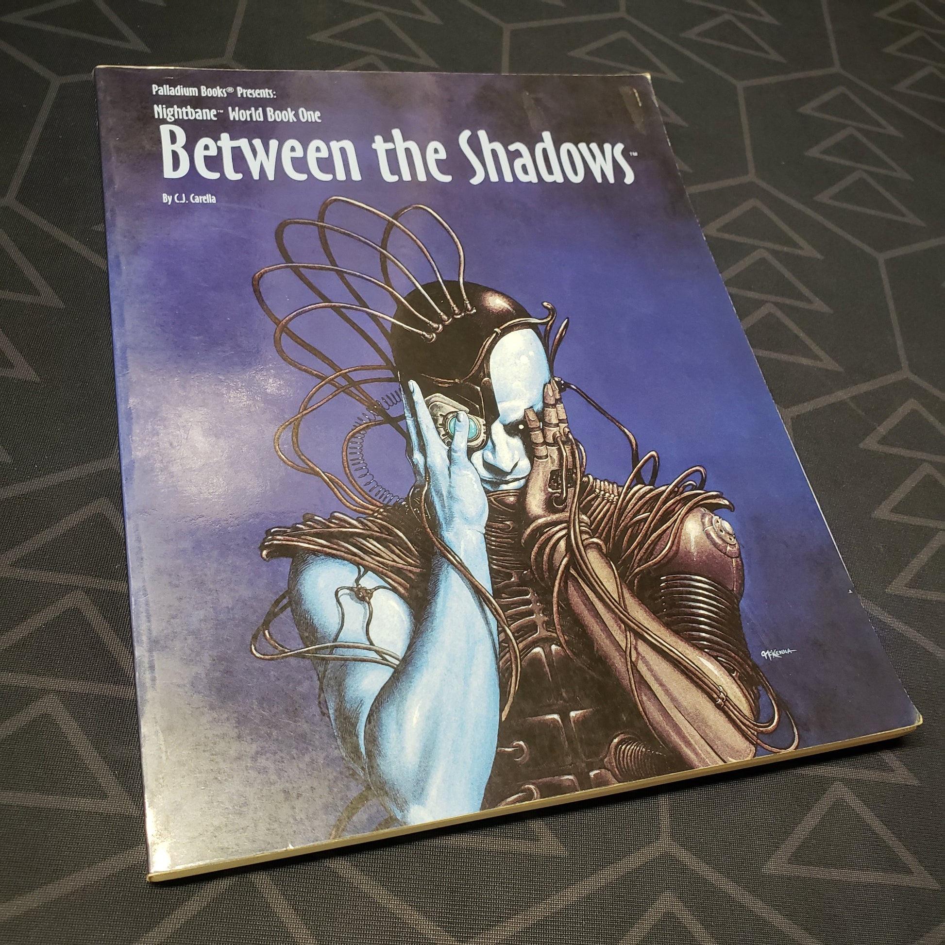 Image shows the front cover of the World Book 1: Between the Shadows book for the roleplaying game Nightbane
