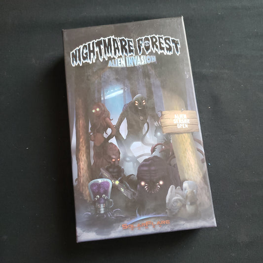 Image shows the front cover of the box of the Nightmare Forest: Alien Invasion card game