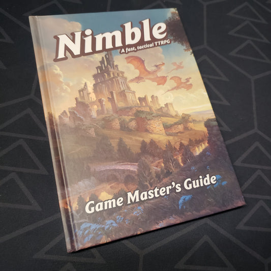 Image shows the front cover of the Game Master's Guide book for the roleplaying game Nimble