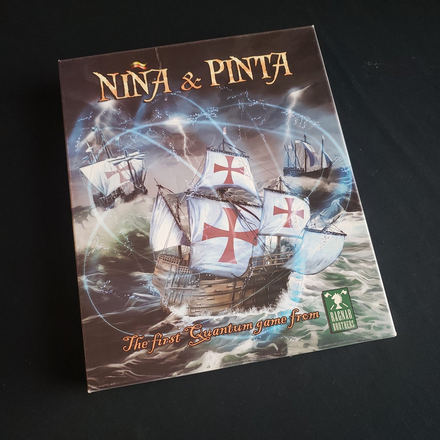 Image shows the front cover of the box of the Nina & Pinta board game