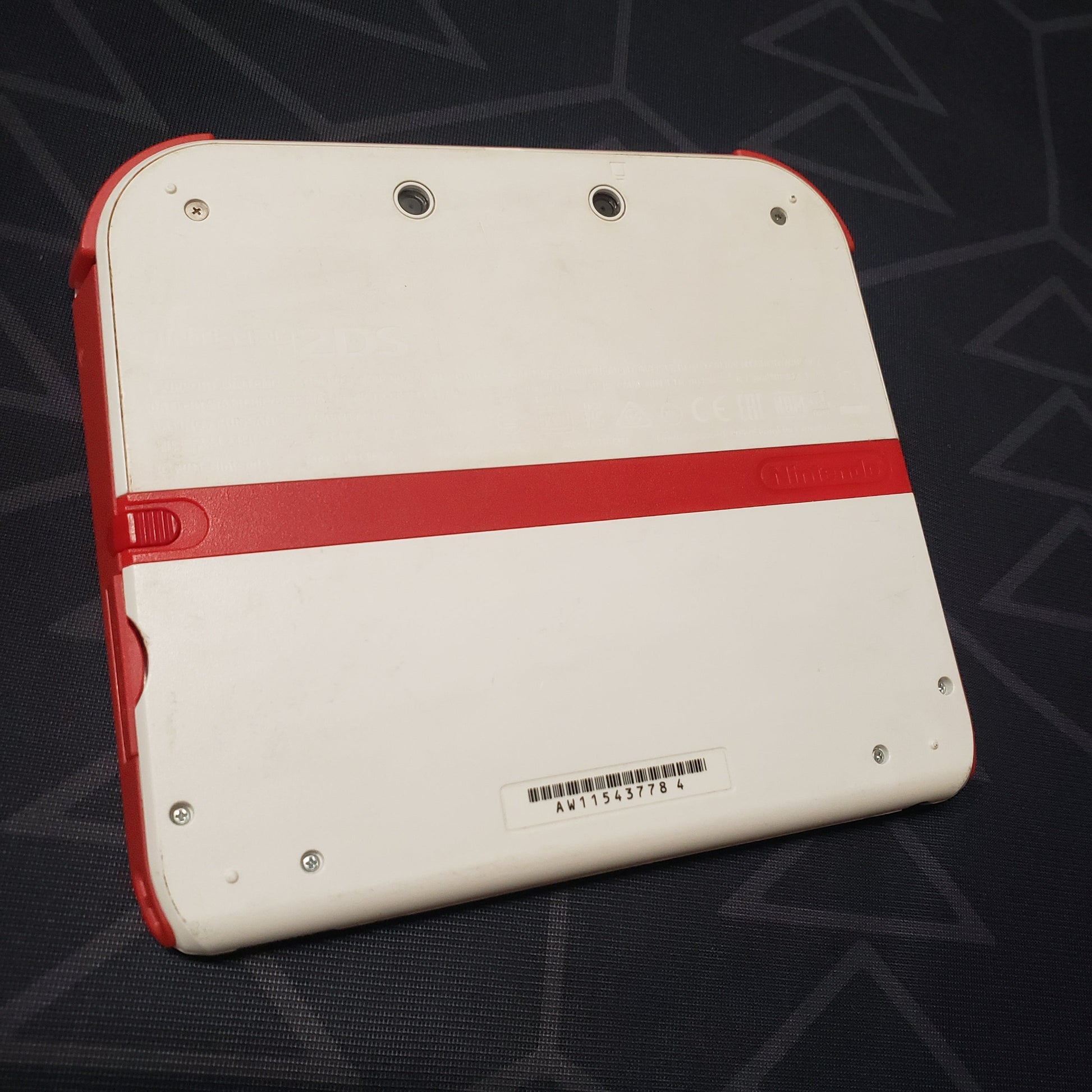 Image shows the back of a Nintendo 2DS: Scarlet Red gaming console