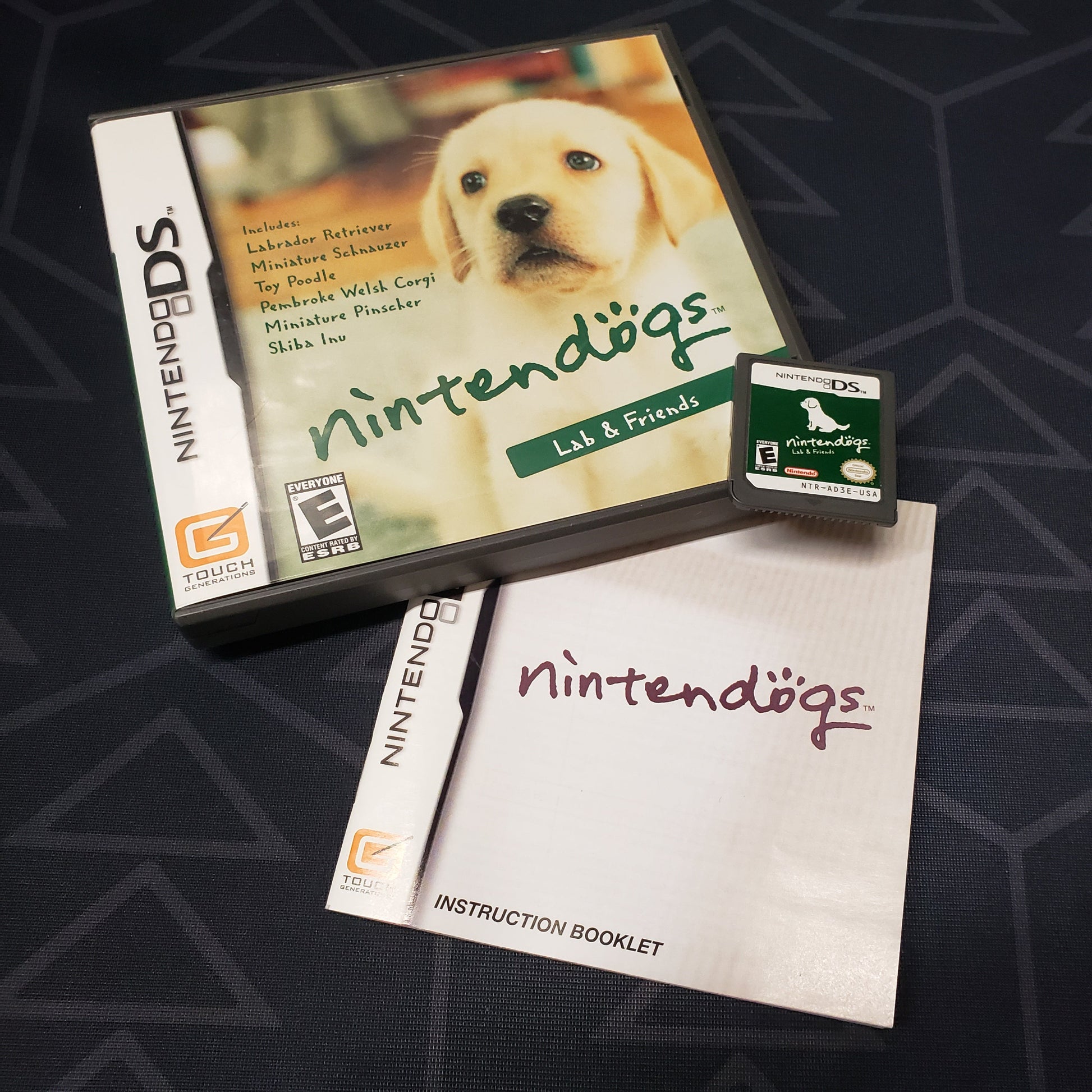 Image shows the case, manual and cartridge for the video game Nintendogs: Lab & Friends for Nintendo DS