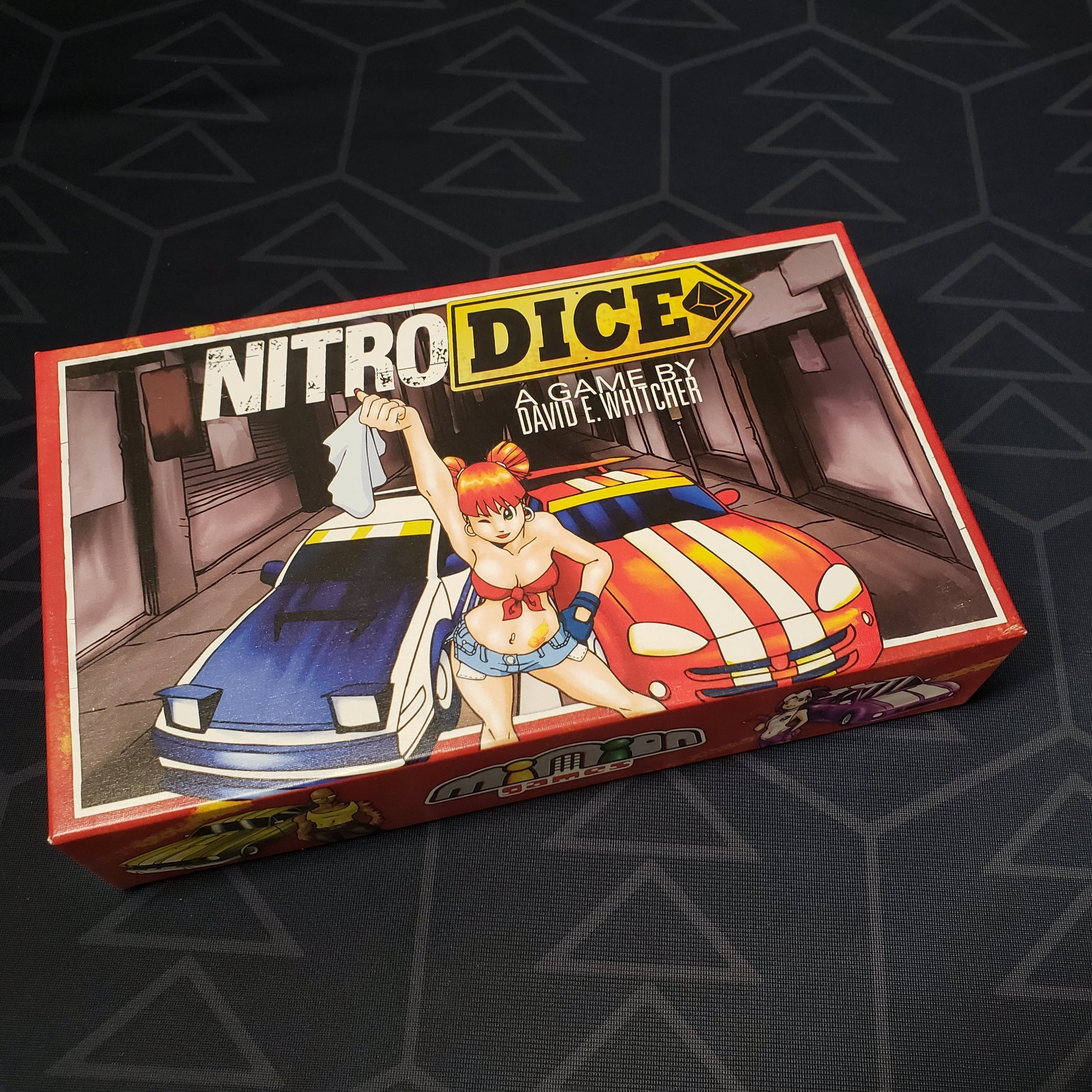 Image shows the front cover of the box of the Nitro Dice board game