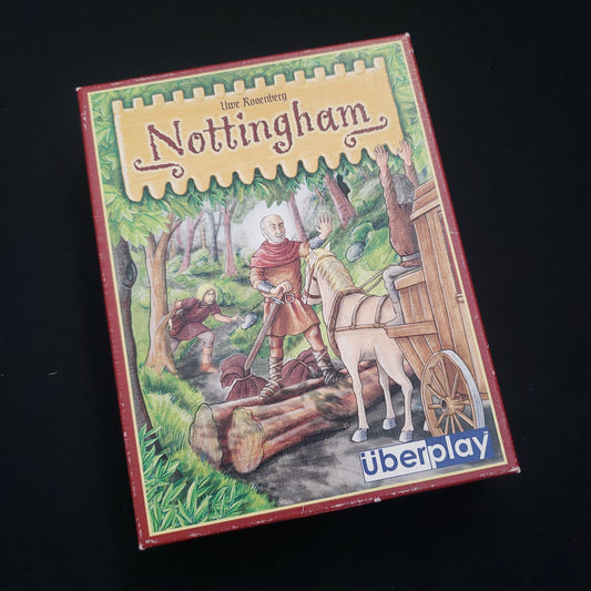 Image shows the front cover of the box of the Nottingham card game