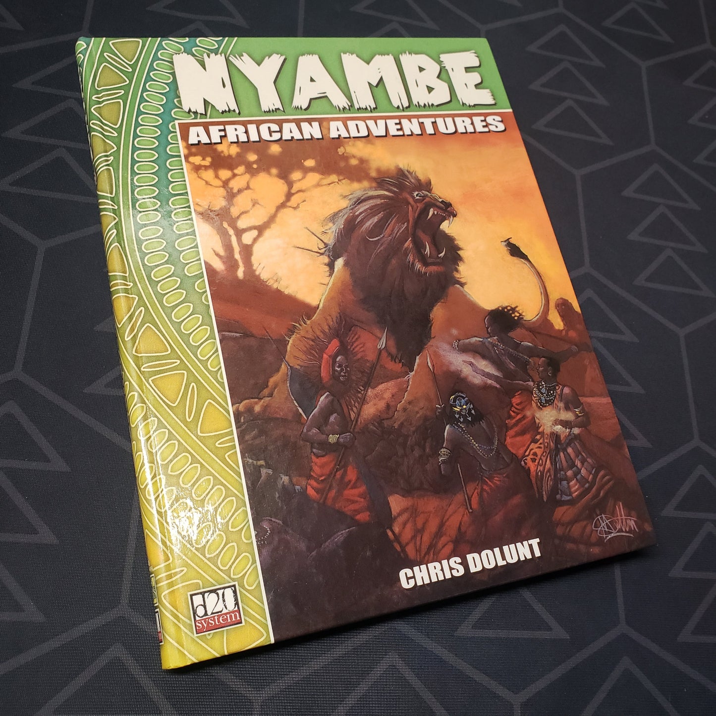 Image shows the front cover of the Nyambe: African Adventures roleplaying game book