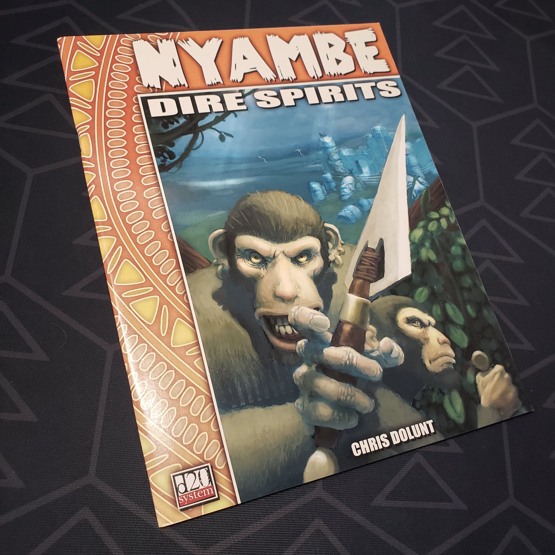 Image shows the front cover of the Nyambe: Dire Spirits roleplaying game book