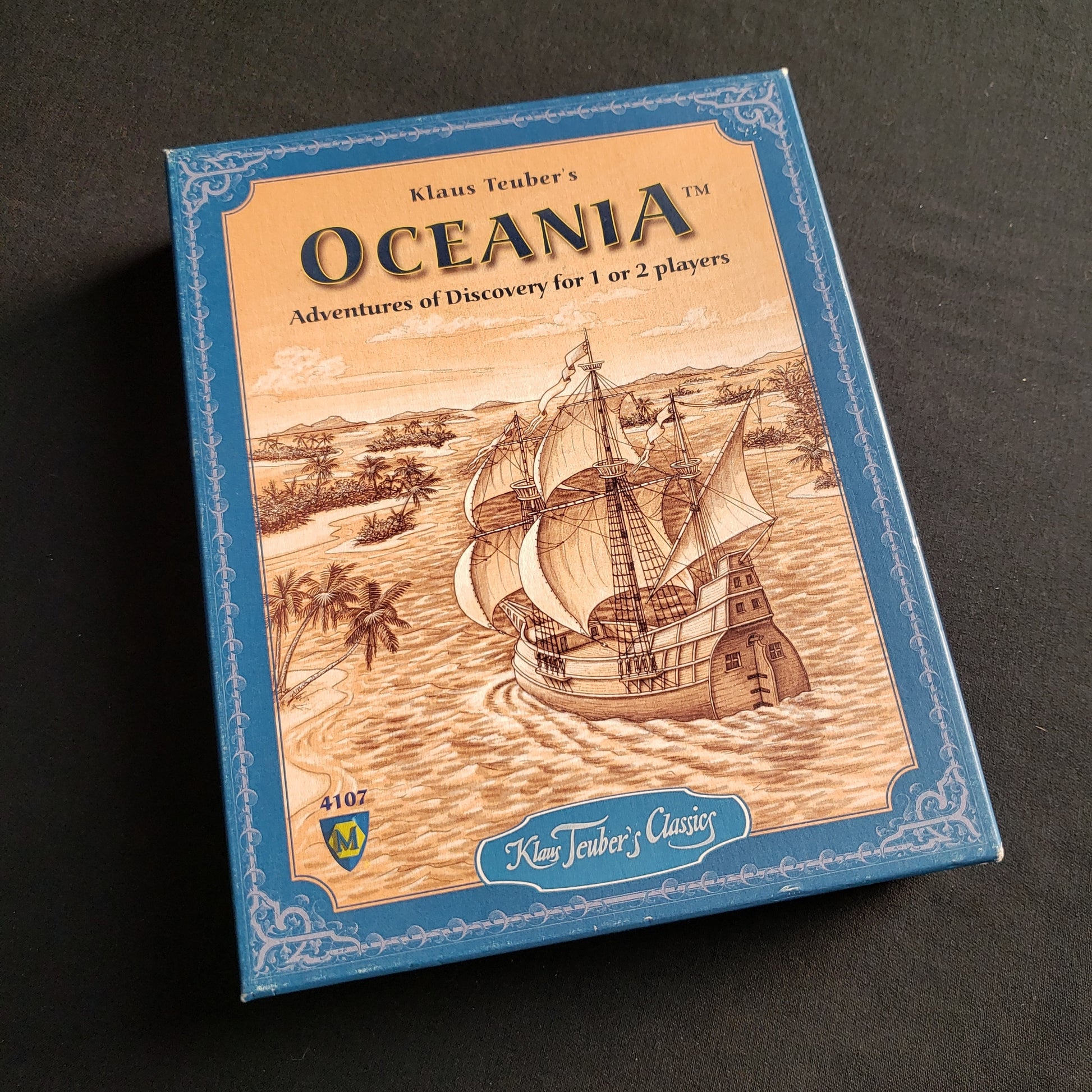 Image shows the front cover of the box of the Oceania board game