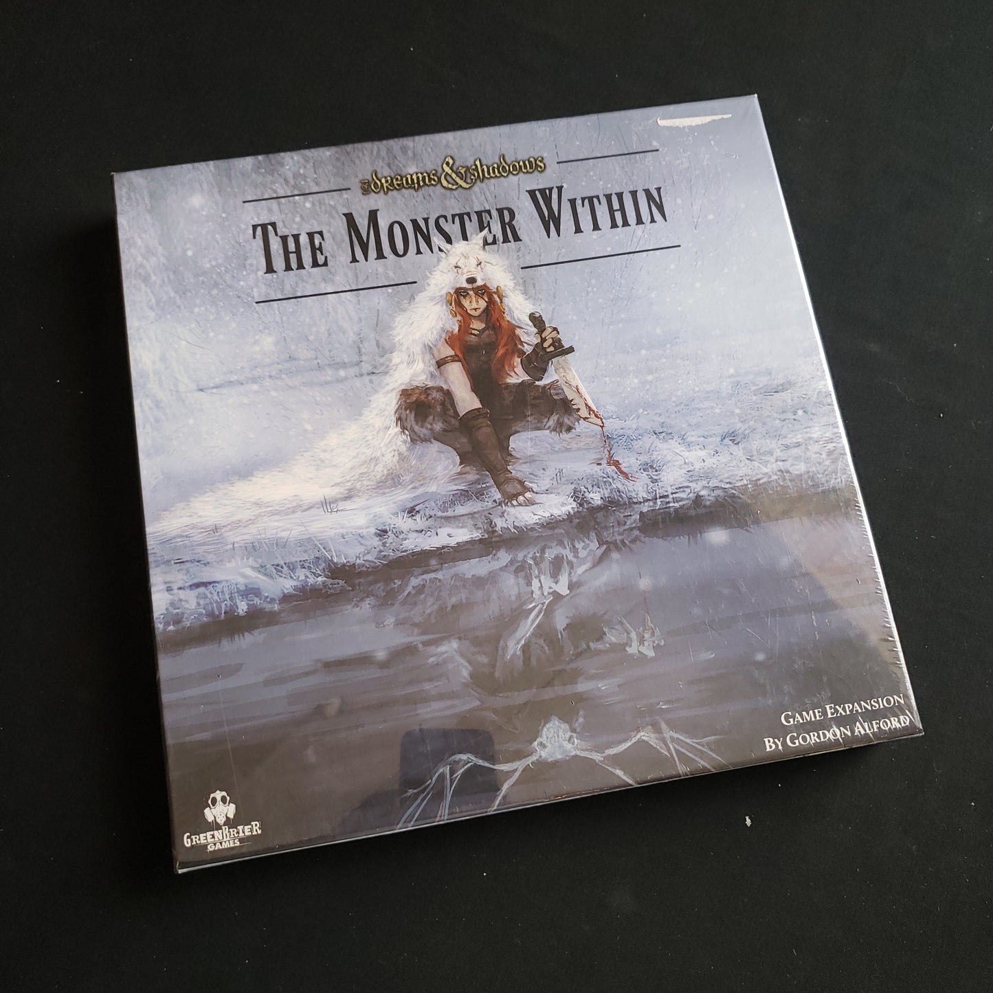 Image shows the front cover of the box of the Monster Within expansion for the board game Of Dreams & Shadows