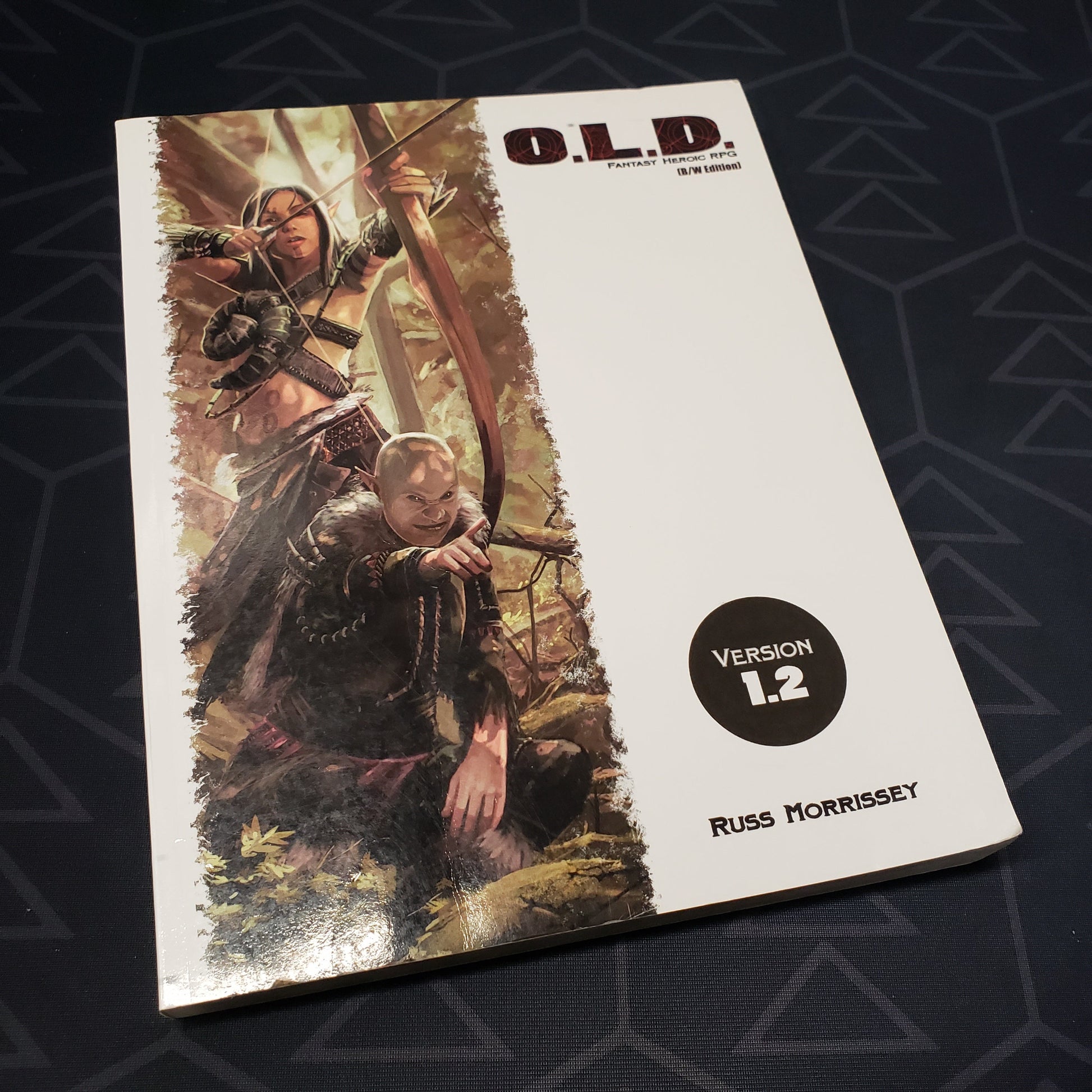 Image shows the front cover of the core rulebook for the roleplaying game O.L.D.: Fantasy Heroic Roleplaying