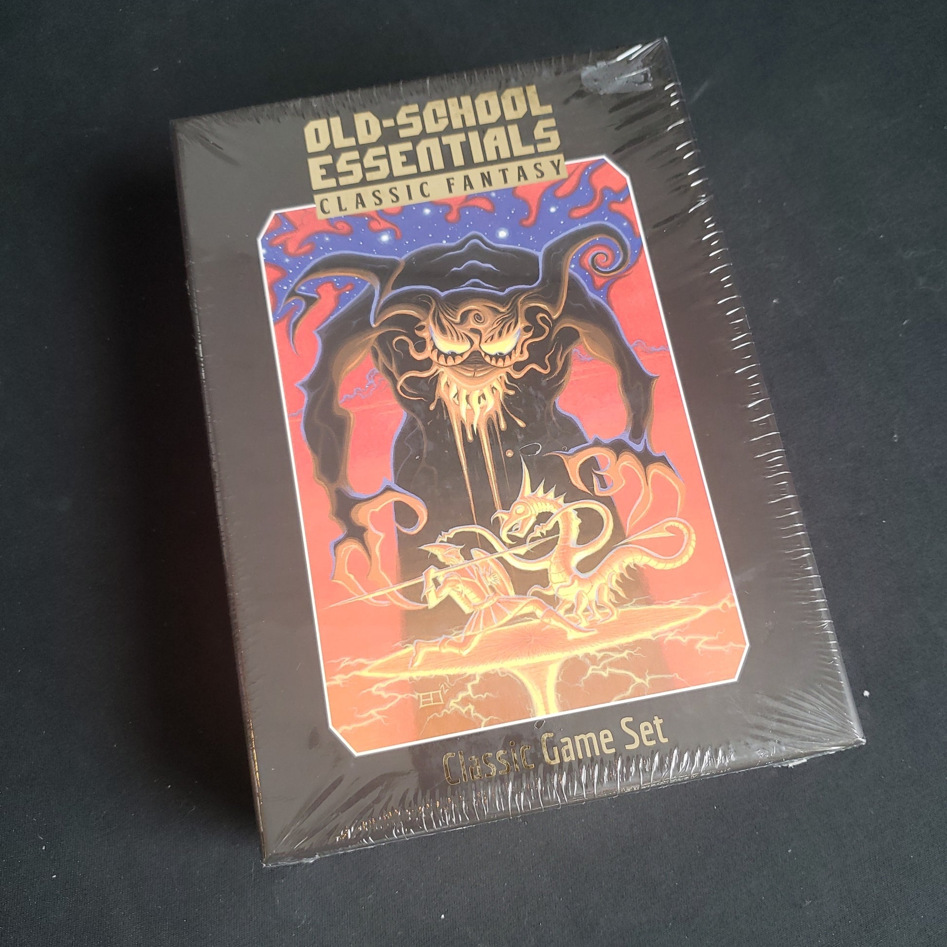 Image shows the front of the box for the Classic Game Set for the Old-School Essentials: Classic Fantasy roleplaying game