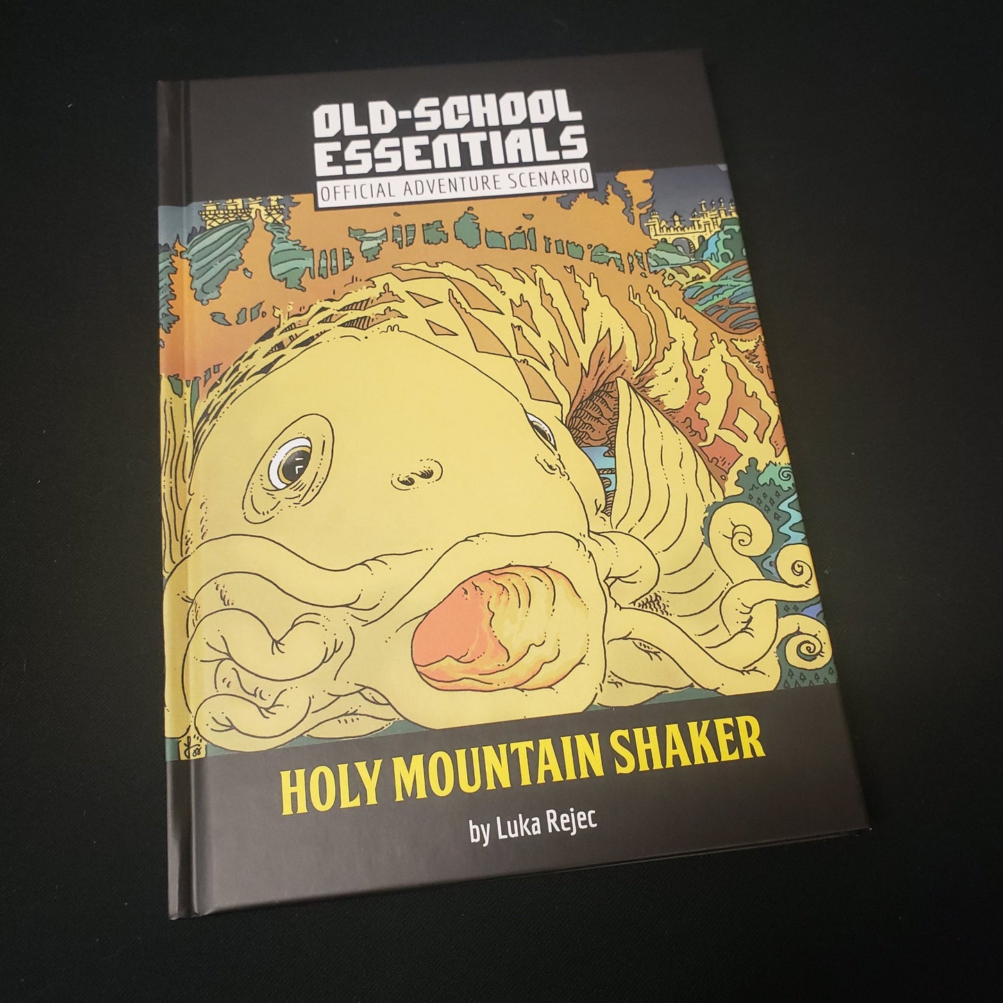 Image shows the front cover of the  Holy Mountain Shaker book for the roleplaying game Old-School Essentials