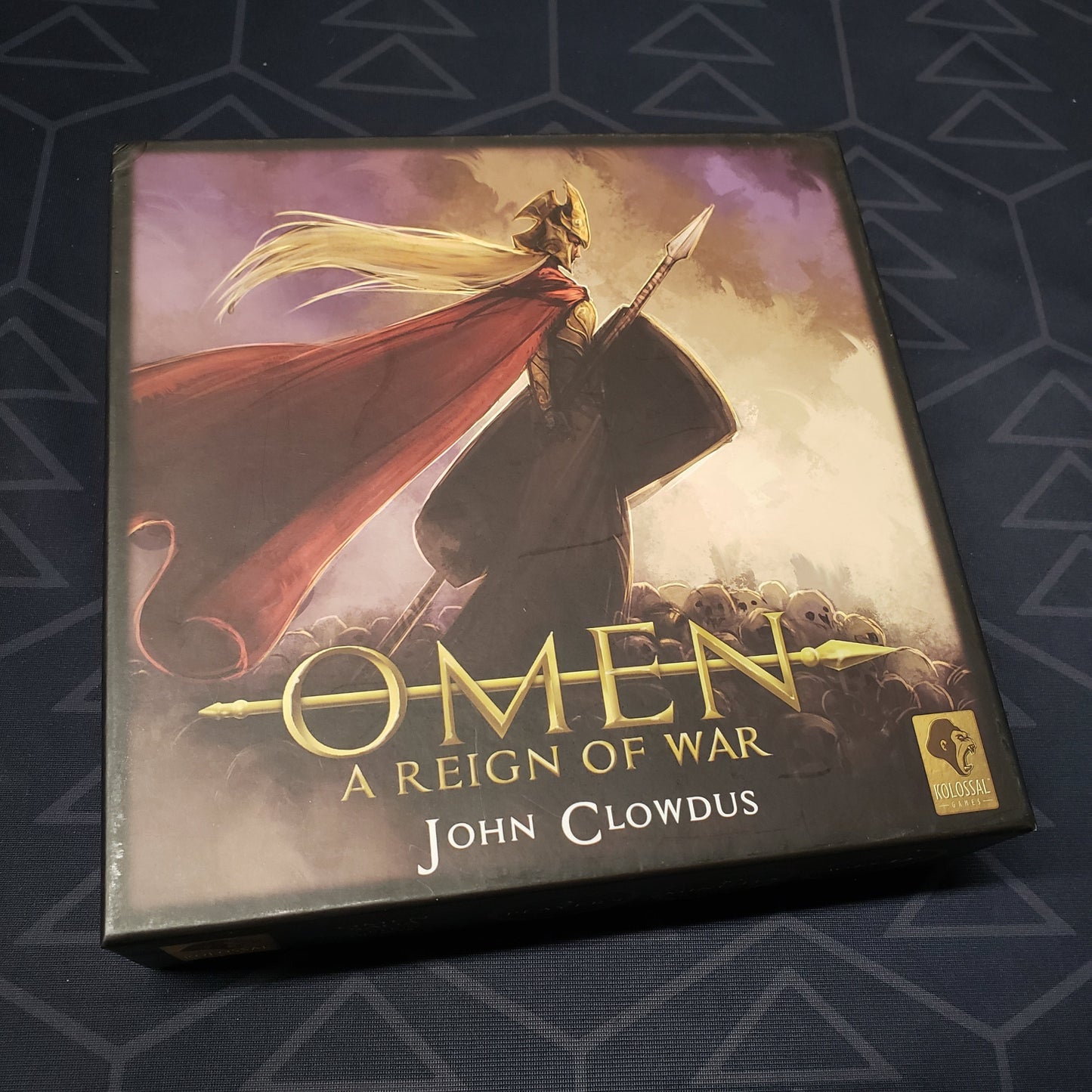 Image shows the front cover of the box of the Omen: A Reign of War card game