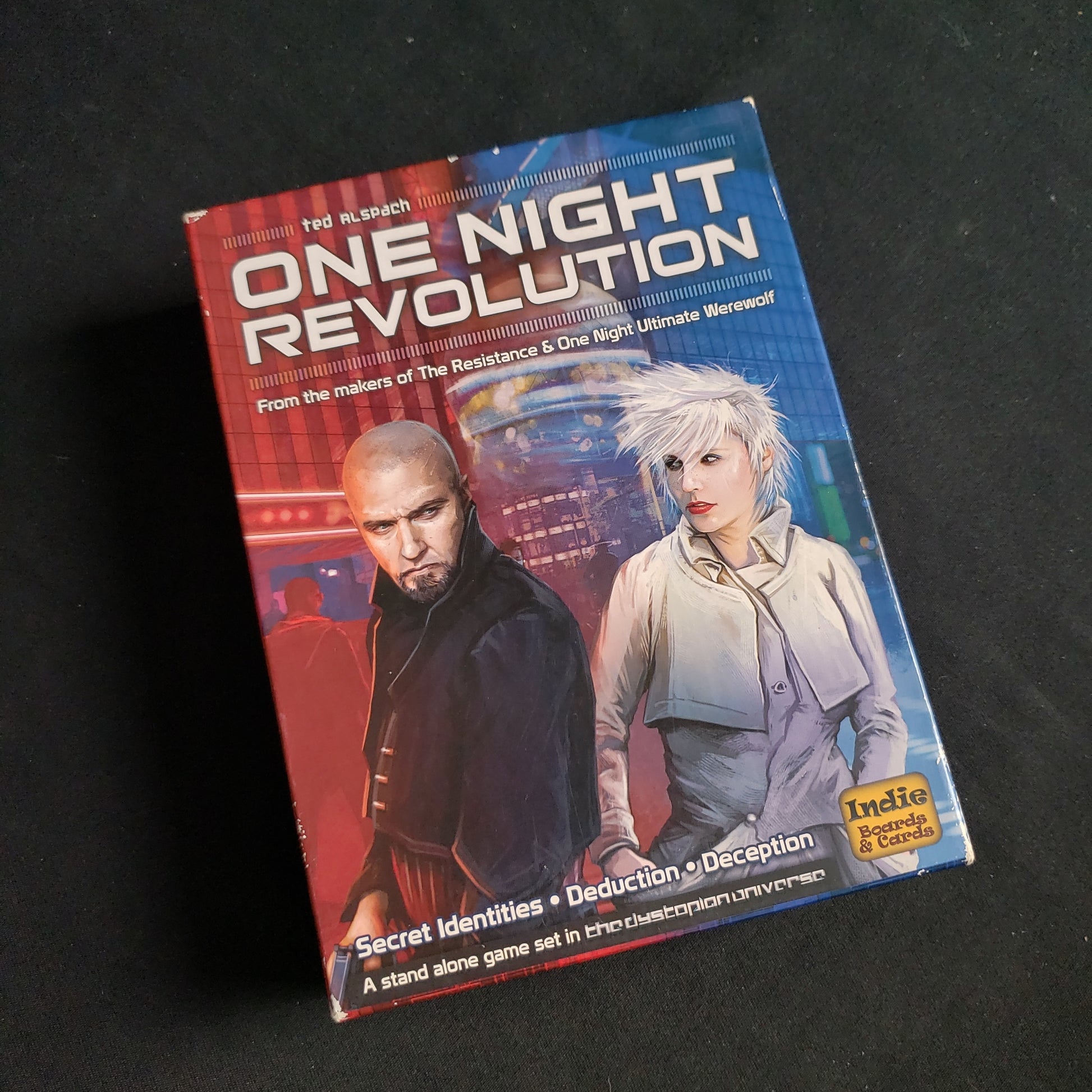 Image shows the front cover of the box of the One Night Revolution game
