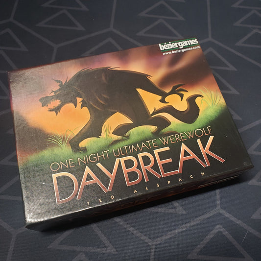 Image shows the front cover of the box for the One Night Ultimate Werewolf Daybreak party game