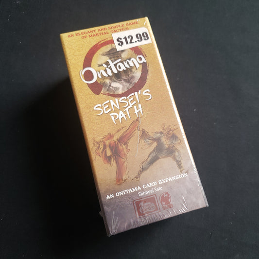 Image shows the front of the box for the Sensei's Path Expansion for the Onitama board game