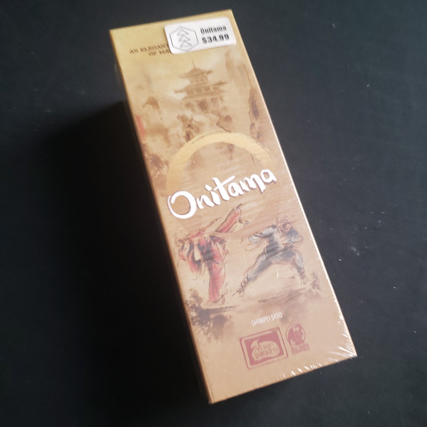 Image shows the front cover of the box of the Onitama board game