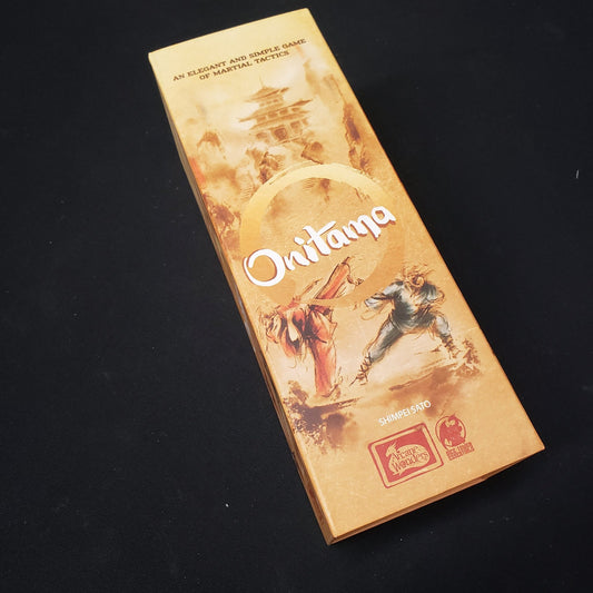 Image shows the front cover of the box of the Onitama board game