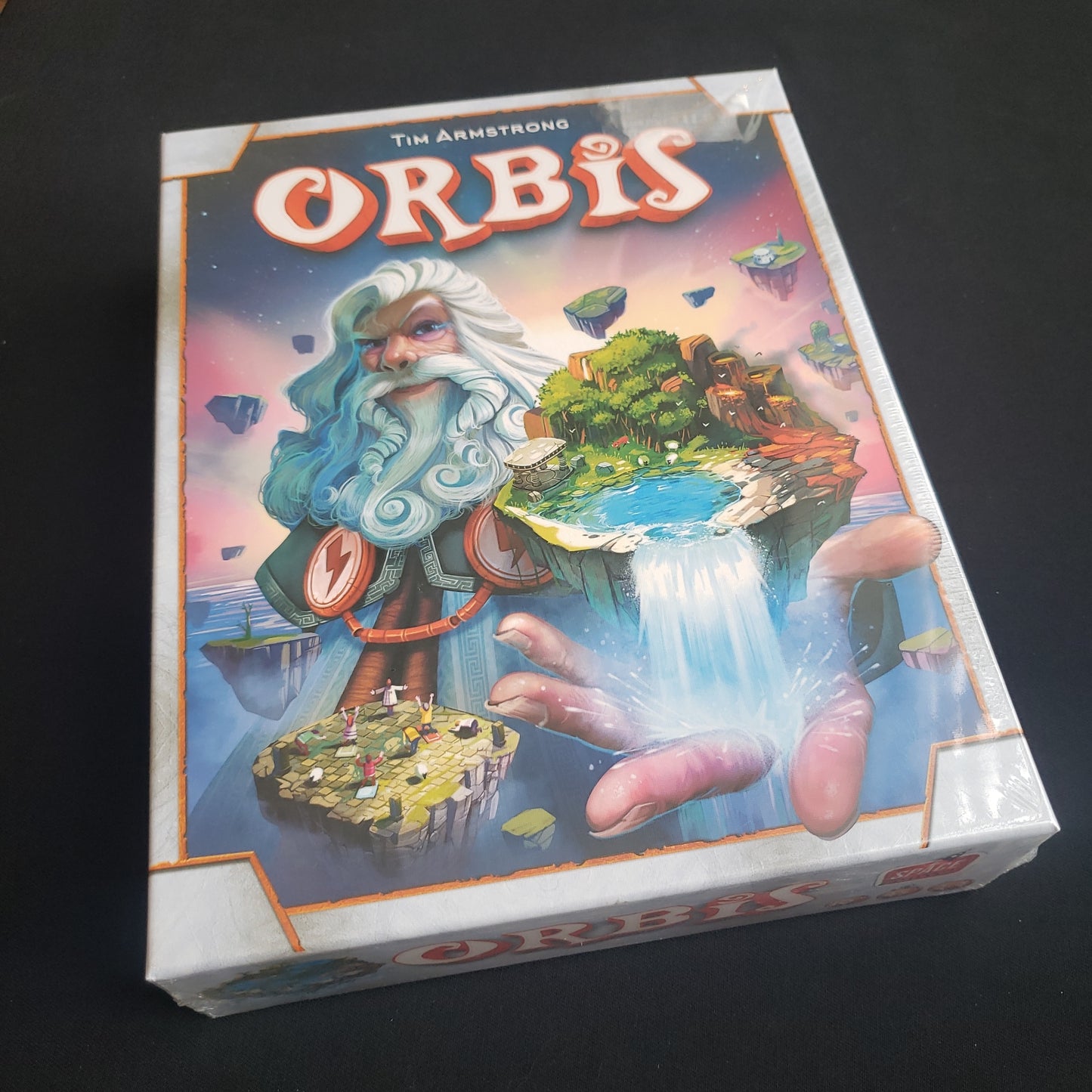 Image shows the front cover of the box of the Orbis board game