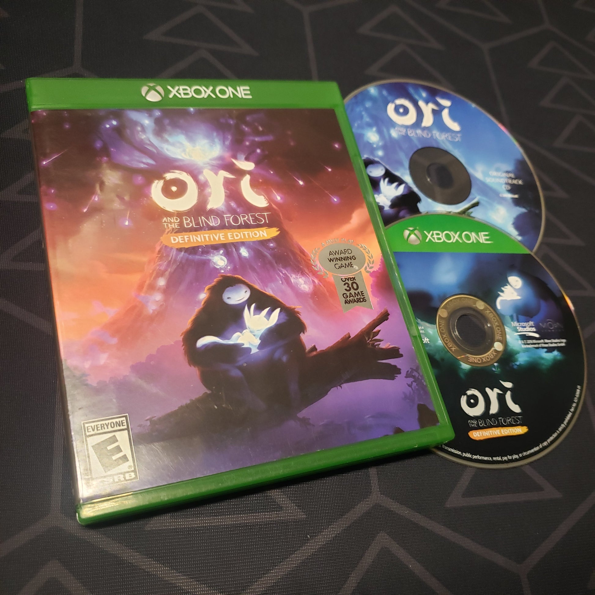 Image shows the case and two discs for the video game Ori and the Blind Forest for Xbox One
