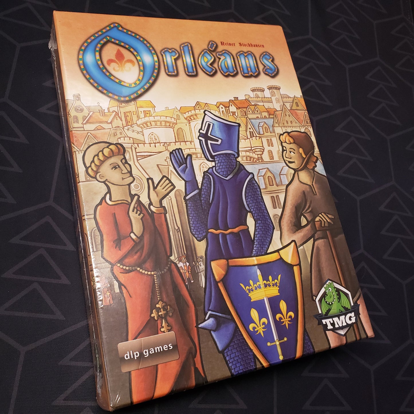 Image shows the front cover of the box for the Orleans board game