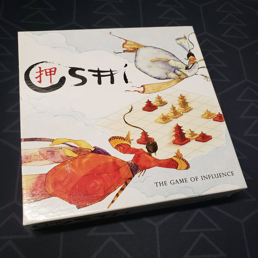 Image shows the front cover of the box for the Oshi board game