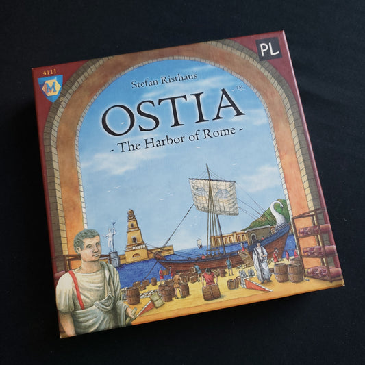Image shows the front cover of the box of the Ostia: The Harbor of Rome board game