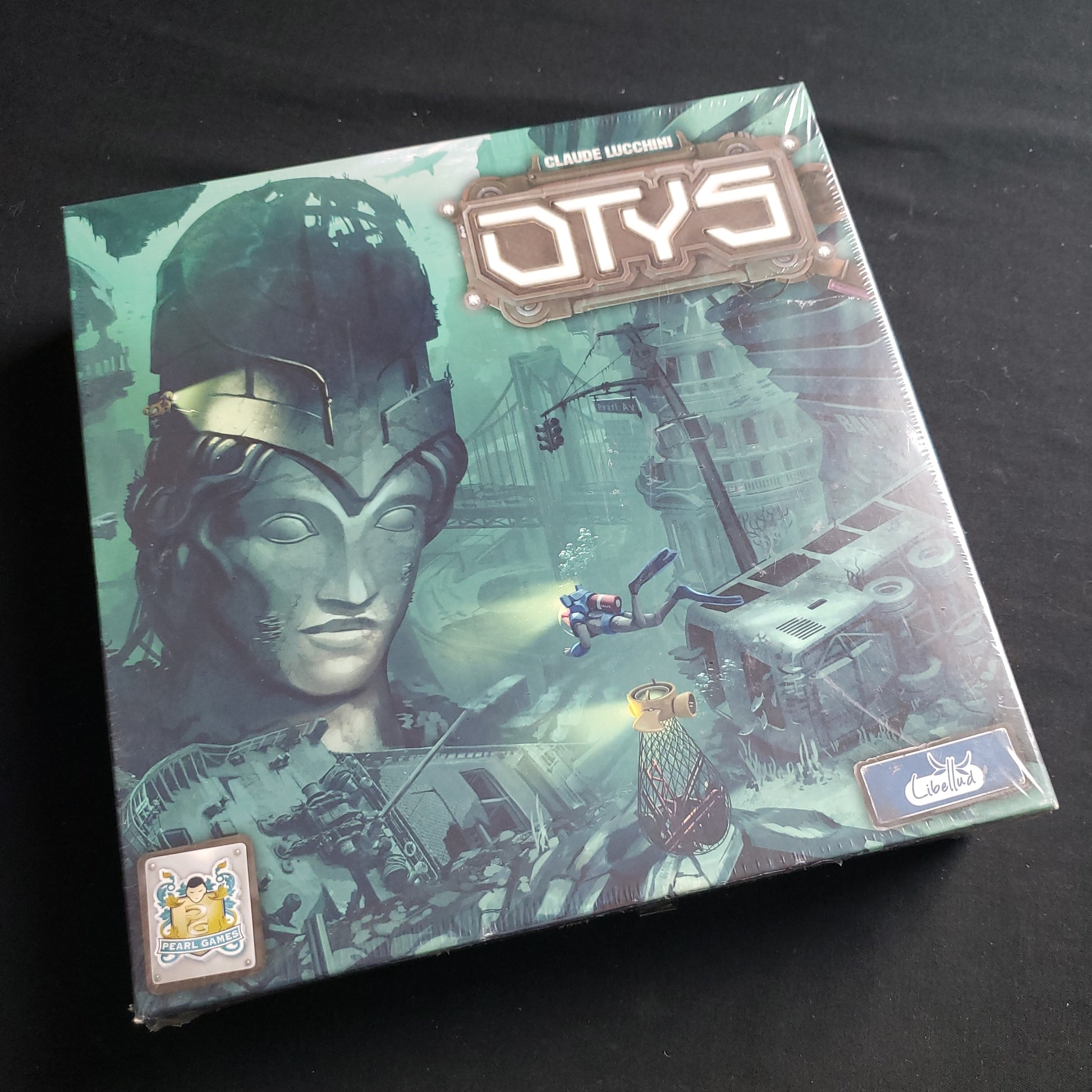 Image shows the front cover of the box of the Otys board game