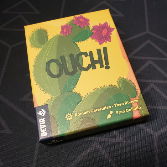 Image shows the front cover of the box for the Ouch! card game