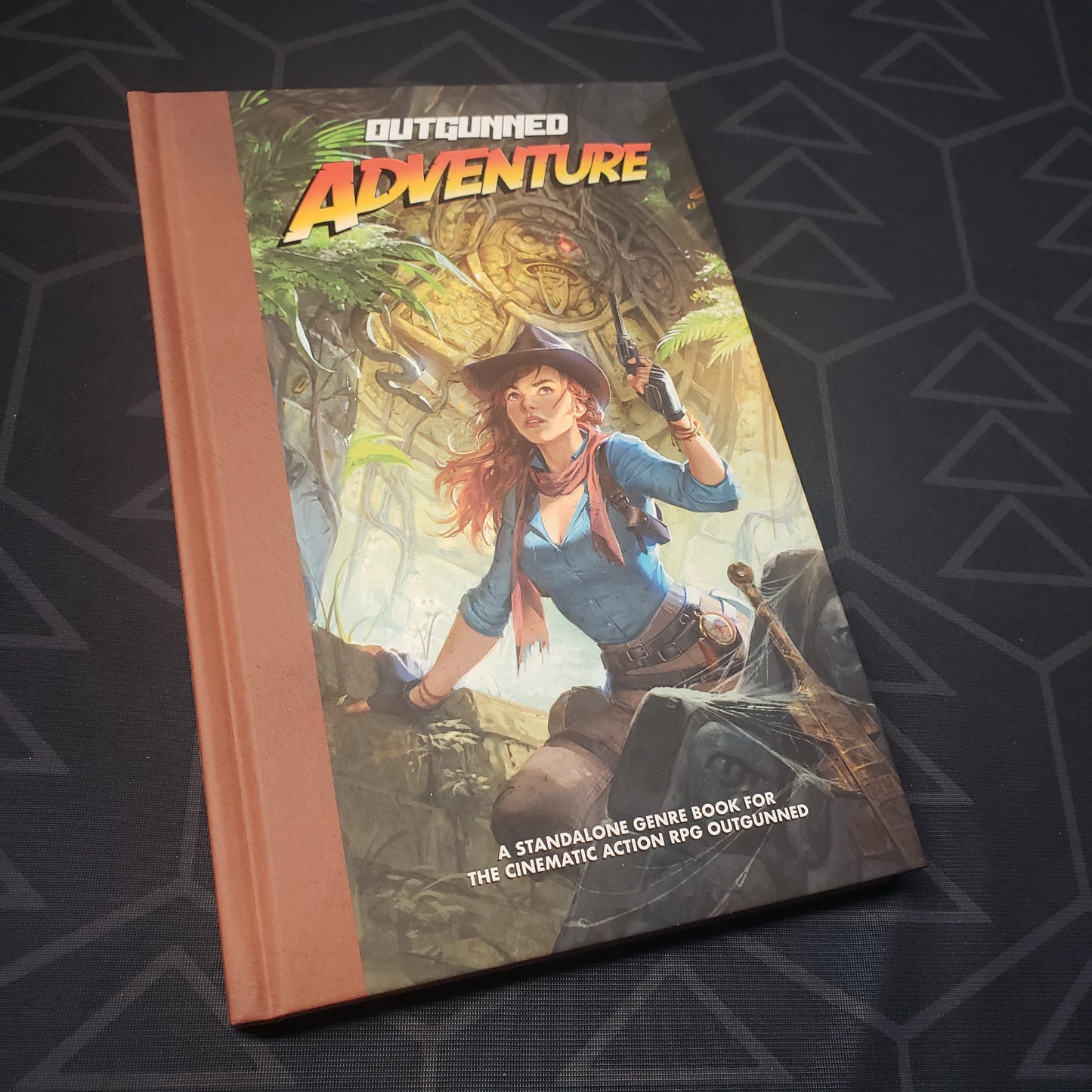 Image shows the front cover of the Adventure book for the roleplaying game Outgunned