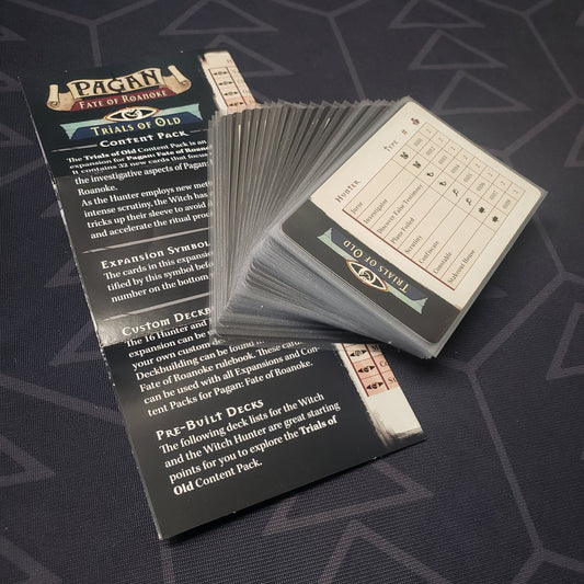 Image shows the fanned-out cards & instruction sheet for the Trials of Old Content Pack expansion for the card game Pagan: Fate of Roanoke