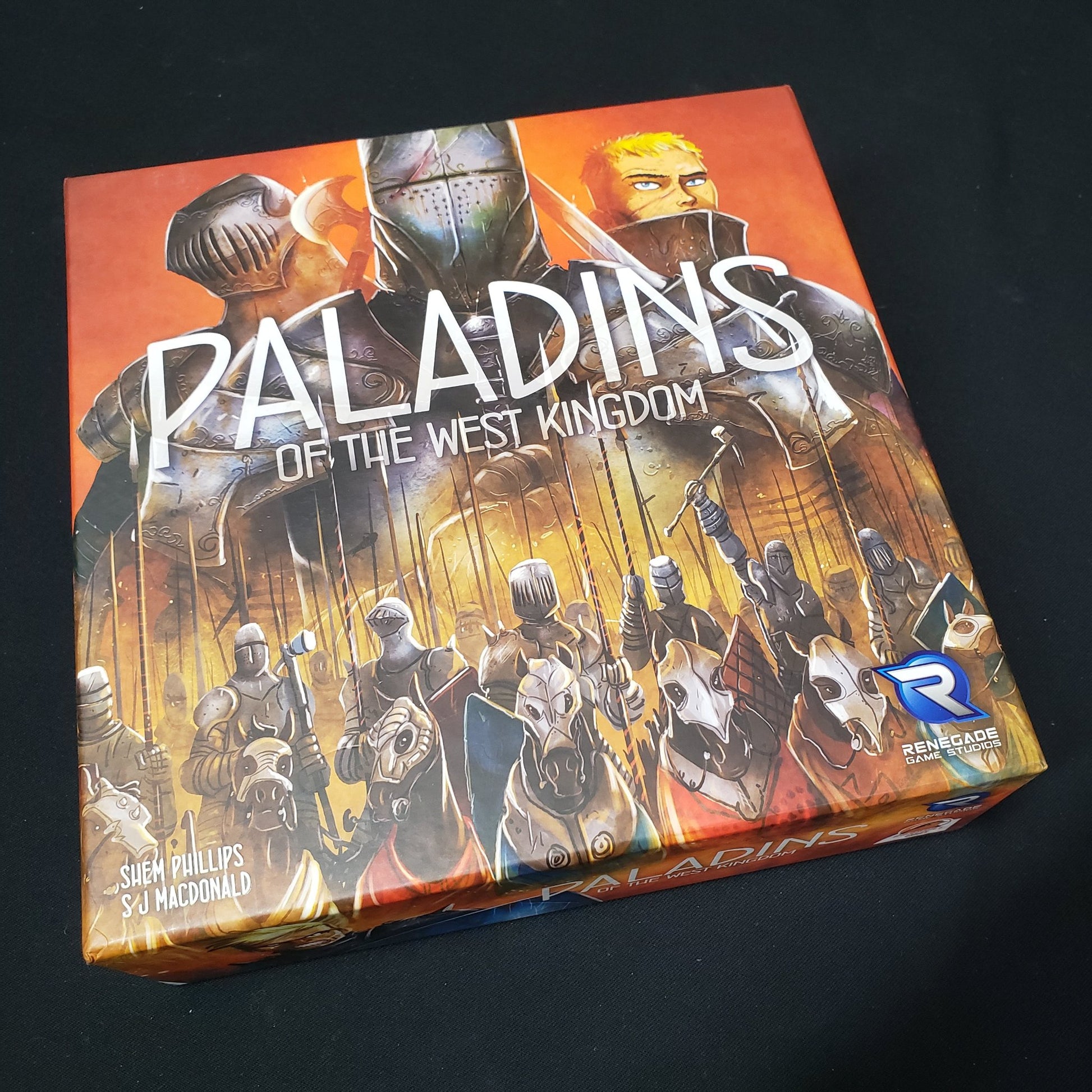 Image shows the front cover of the box of the Paladins of the West Kingdom board game