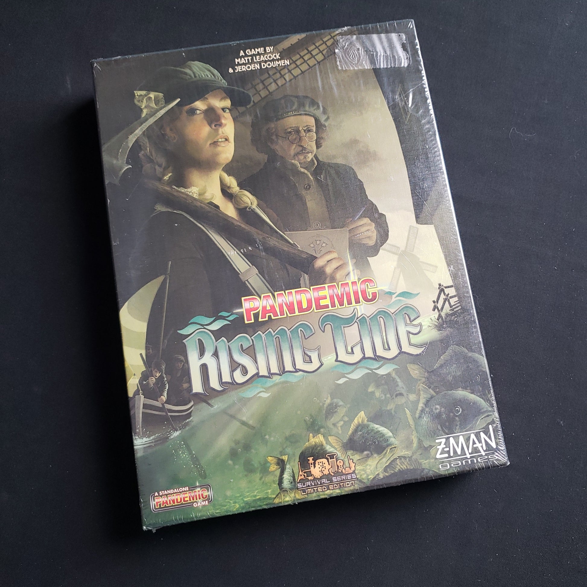 Image shows the front cover of the box of the Pandemic: Rising Tide board game