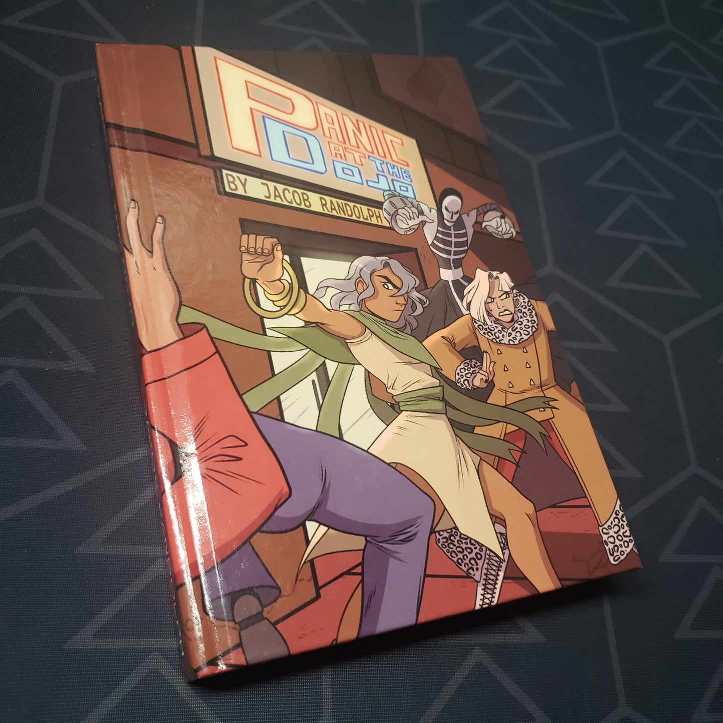 Image shows the front cover of the Panic at the Dojo roleplaying game book