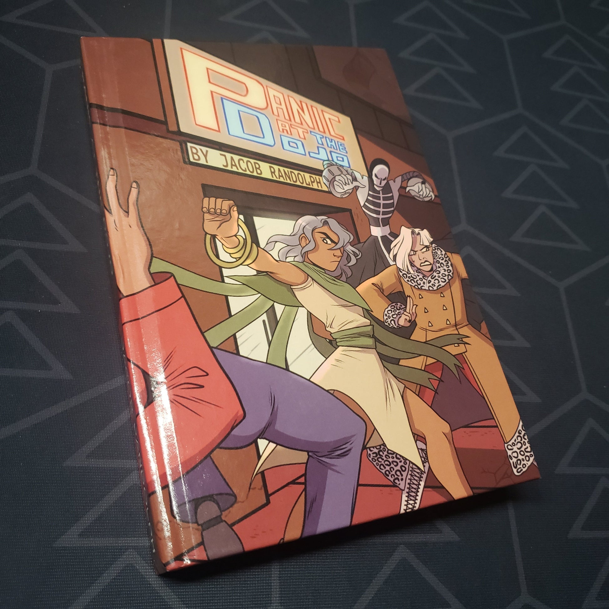 Image shows the front cover of the Panic at the Dojo roleplaying game book