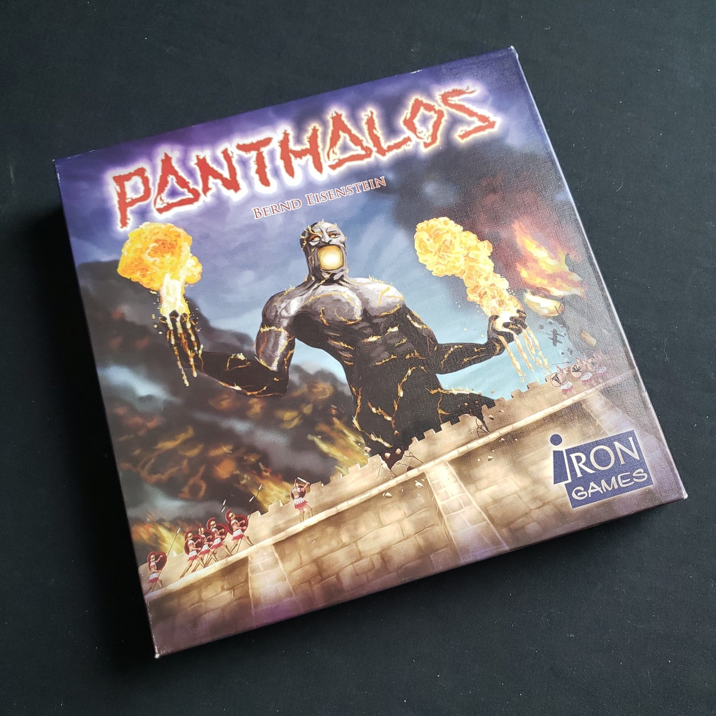 Image shows the front cover of the box of the Panthalos board game