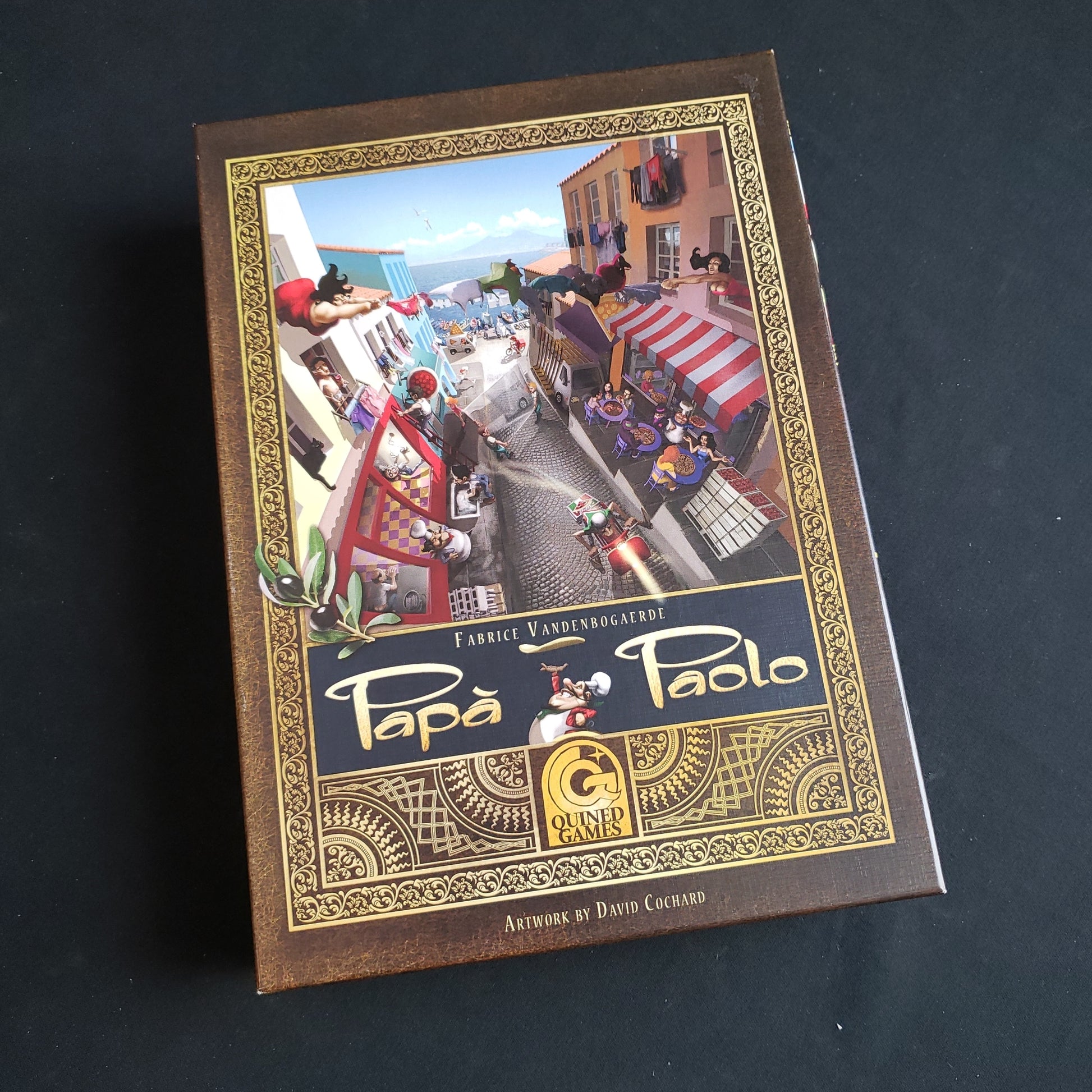 Image shows the front cover of the box of the Papa Paolo board game