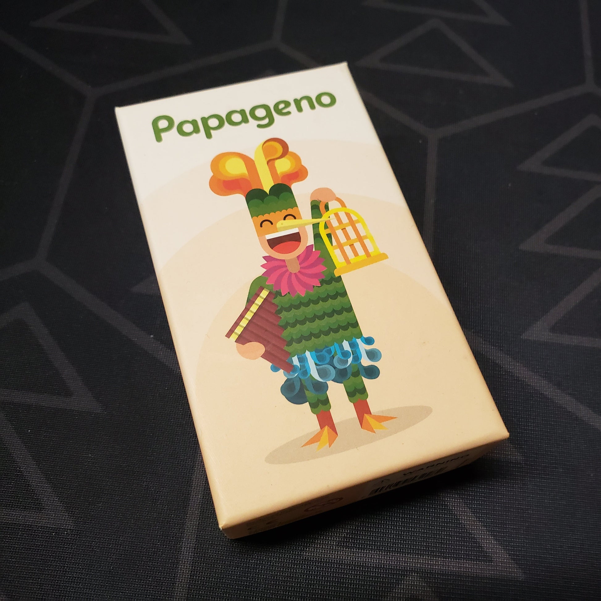 Image shows the front cover of the box for the Papageno card game