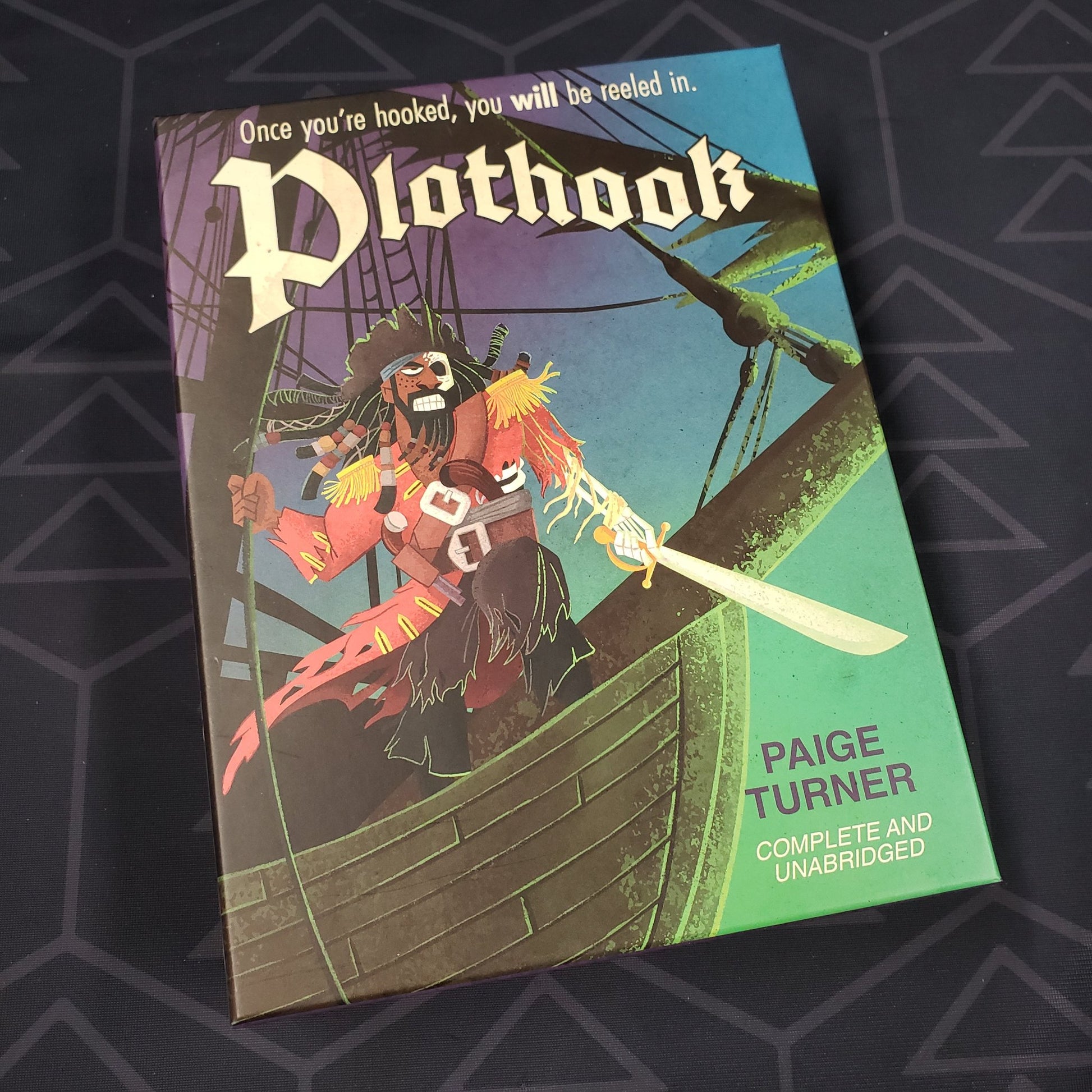 Image shows the front of the box for the Plothook character expansion for the card game Paperback Adventures