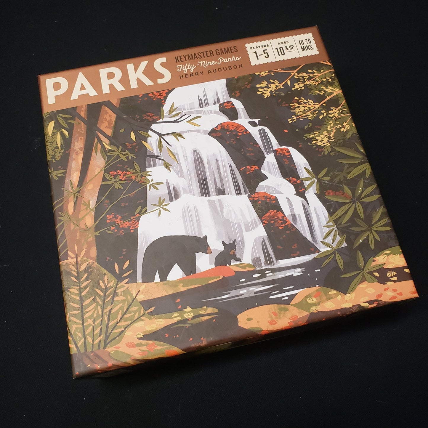 Image shows the front cover of the box of the PARKS board game