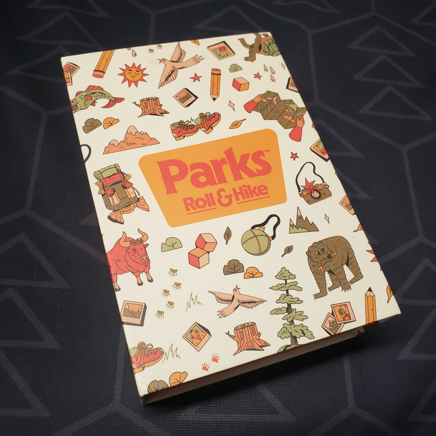 Image shows the front cover of the box for the Parks: Roll & Hike board game
