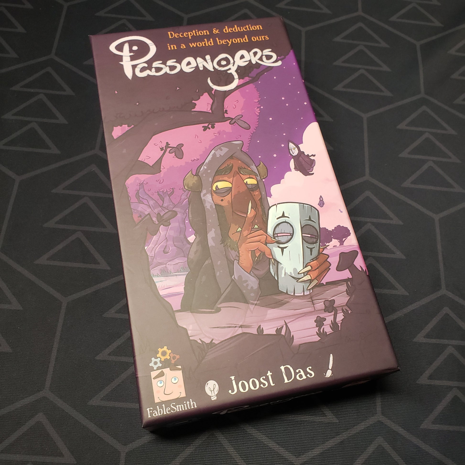 Image shows the front cover of the box for the Passengers board game