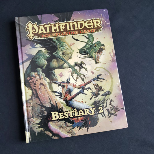 Image shows the front cover of the Bestiary 2 book for the Pathfinder 1E roleplaying game