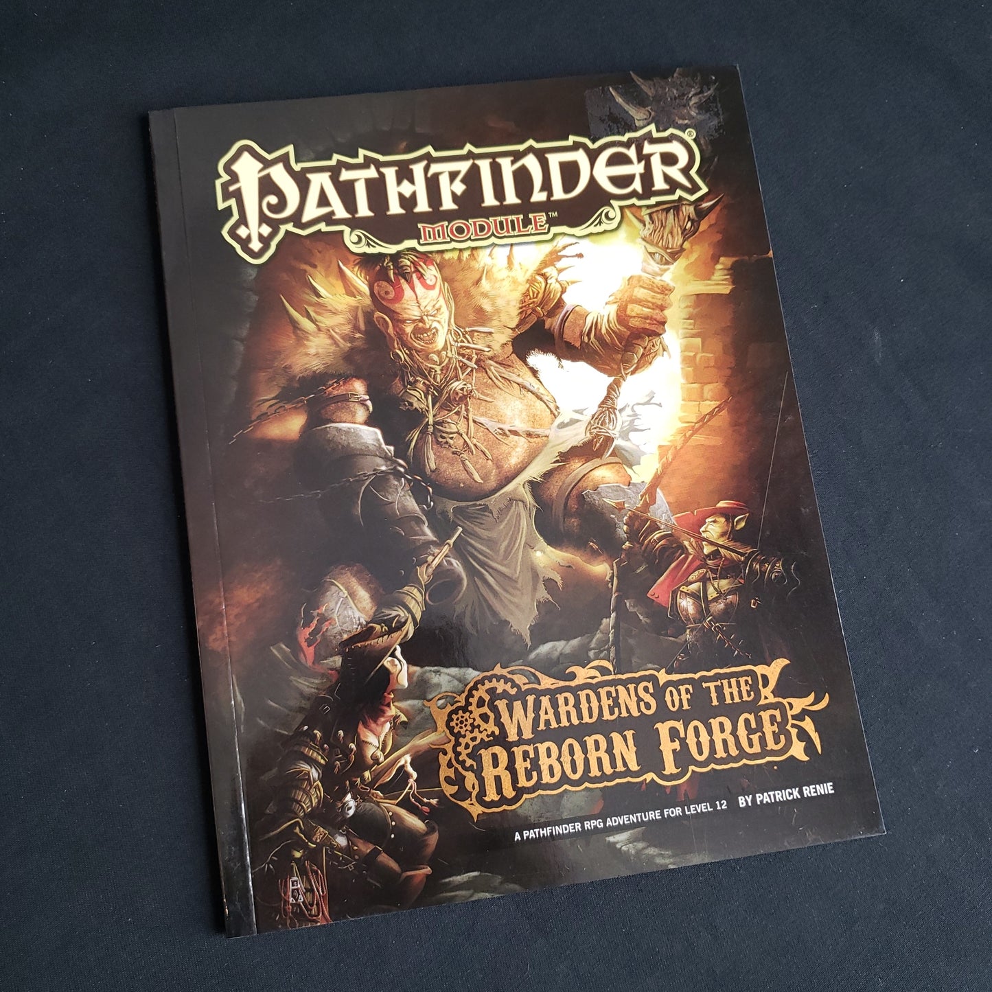 Image shows the front cover of the Wardens of the Reborn Forge book for the Pathfinder 1E roleplaying game